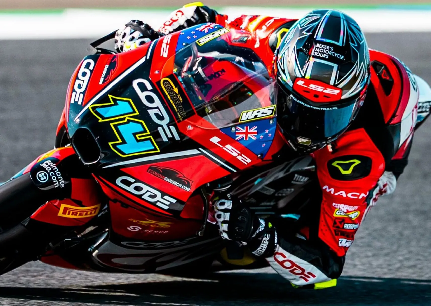 Close-up of Cormac Buchanan tucked in on his red number 14 Moto3 bike in Germany